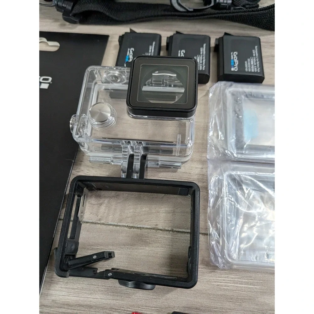 GoPro Hero 4 Silver Edition- with Accessories and Case Included